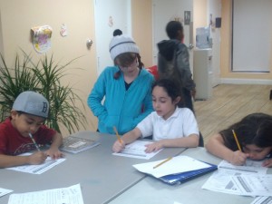 My daughter, Juliana, helping Yasmine with her Bible Lesson.