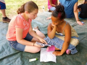 Vivienne leading Naoshi through a gospel booklet in 2012.