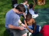 John leads this child through a gospel booklet after a kids meeting.