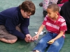 Justin counseling a child after a kids meeting.