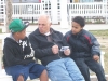 Eric shares Christ with two of the children after the meeting.