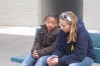 Paula sharing the gospel with a young girl after a meeting.