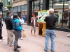 Justin preaching in the open air.