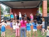 My daughters, Vivienne (in blue on the left), and Juliana (in pink on the right), as well as other girls from our church lead the kids in worship songs!