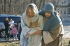 Joseph bringing a very-pregnant Mary into Bethlehem.